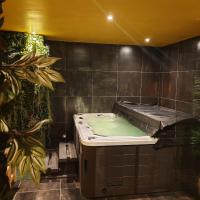 a bathroom with a bath tub in a room at Cour st Didier in Nevers
