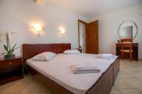 A bed or beds in a room at Apartments Lina