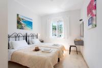 A bed or beds in a room at Ariti Apartments