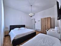 A bed or beds in a room at La Ca' Bianca Affittaly Apartments
