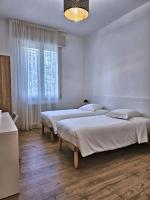 A bed or beds in a room at La Ca' Bianca Affittaly Apartments