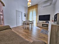 A television and/or entertainment centre at La Ca' Bianca Affittaly Apartments
