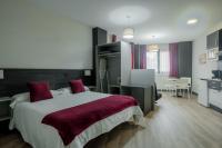 Postel nebo postele na pokoji v ubytování Apartamentos Capua
