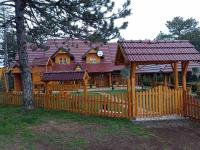a wooden fence in front of a house at Vila Perisic in Kaludjerske Bare