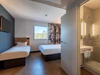Posteľ alebo postele v izbe v ubytovaní B&B HOTEL Landerneau Bois Noir