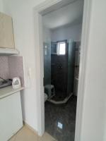 a bathroom with a shower and a toilet in a room at Theofanis Studios in Agia Anna Naxos