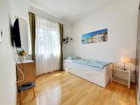 a small room with a bed and a window at Design Apartments Bonavista in Opatija
