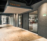 an empty entrance to a store with glass doors at Orange Hotel - Ximen, Taipei in Taipei