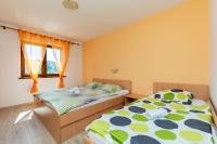 Postel nebo postele na pokoji v ubytování Apartments Mario