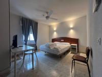Posteľ alebo postele v izbe v ubytovaní Hostal la Embajada