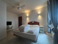 Posteľ alebo postele v izbe v ubytovaní Hostal la Embajada