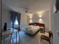 Posteľ alebo postele v izbe v ubytovaní Hostal la Embajada