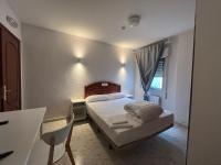 Posteľ alebo postele v izbe v ubytovaní Hostal la Embajada
