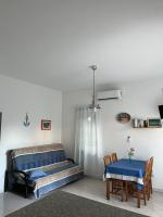 Posteľ alebo postele v izbe v ubytovaní Villa Claudia Beach Apartment