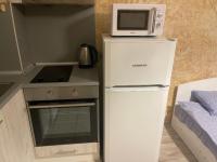 A kitchen or kitchenette at Colonel apartment 956