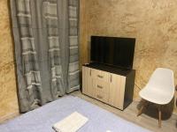 A television and/or entertainment centre at Colonel apartment 956
