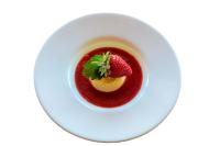 a bowl of sauce with a strawberry on top at Locanda Poggioleone in Castiglione del Lago