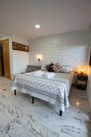 Postel nebo postele na pokoji v ubytování Suites Beach Nature