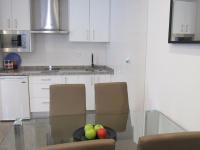 A kitchen or kitchenette at Apartamentos Ilíberis