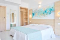 Łóżko lub łóżka w pokoju w obiekcie Hotel Gami Adults Only
