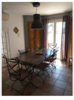 a dining room with a wooden table and chairs at Maison en Provence in Salon-de-Provence