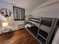 Łóżko lub łóżka w pokoju w obiekcie PORTICCIO villa dans résidence avec piscines 4-6 personnes BRILOC Appartements