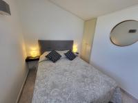 Łóżko lub łóżka w pokoju w obiekcie PORTICCIO villa dans résidence avec piscines 4-6 personnes BRILOC Appartements