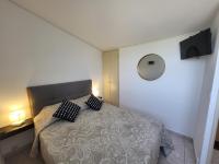 Łóżko lub łóżka w pokoju w obiekcie PORTICCIO villa dans résidence avec piscines 4-6 personnes BRILOC Appartements