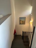 a stairway with a picture on the wall at Sur le Pont in Vaison-la-Romaine