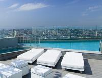 a balcony with a swimming pool on top of a building at The Marmara Pera in Istanbul