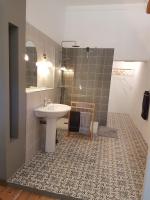a bathroom with a sink and a shower at domaine de Capoulade in Narbonne
