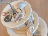 two bowls filled with different types of rocks and shells at Apartment Zeebries by Interhome in Bredene