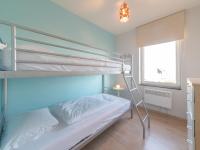 a bedroom with a bunk bed with a ladder at Apartment Zeebries by Interhome in Bredene