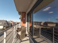 a balcony with a view of the city seen through a window at Apartment Zeebries by Interhome in Bredene