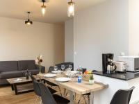 a kitchen and living room with a table and chairs at Apartment Plasenn by Interhome in Saint Malo