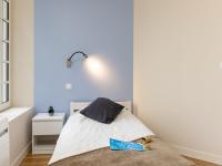 a bedroom with a bed with a book on it at Apartment Plasenn by Interhome in Saint Malo