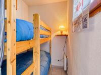 a couple of bunk beds in a small room at Apartment Le Sunset-Cap Sud-23 by Interhome in Cap d&#39;Agde