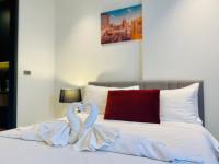 Postel nebo postele na pokoji v ubytování Edge Central Pattaya Vip Condo