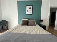 Cama ou camas em um quarto em Appartement F5 - Spacieux et lumineux