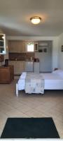 a large room with two beds and a kitchen at Villa Playa del Sol -B4 in Saint-Tropez