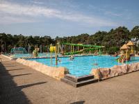 a large swimming pool with people playing in it at De Goolder in Bocholt