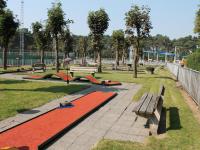 a park with a bench and a red carpet at De Goolder in Bocholt