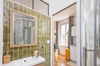 a bathroom with a sink and a mirror at Studio front de mer en centre-ville de Cabourg in Cabourg