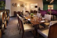 a dining room with a table and chairs at Sheraton Gateway Los Angeles Hotel in Los Angeles