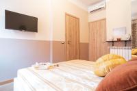 Łóżko lub łóżka w pokoju w obiekcie Royal Rooms - Elegante appartamento nel cuore di Roma