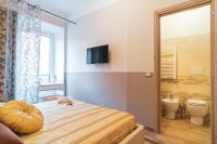 Łóżko lub łóżka w pokoju w obiekcie Royal Rooms - Elegante appartamento nel cuore di Roma
