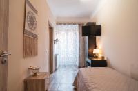 Łóżko lub łóżka w pokoju w obiekcie Royal Rooms - Elegante appartamento nel cuore di Roma