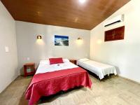 Cama ou camas em um quarto em Pousada e Restaurante Paraíso Natural