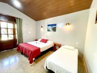 Cama ou camas em um quarto em Pousada e Restaurante Paraíso Natural