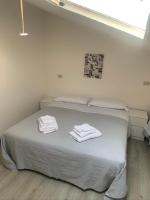 A bed or beds in a room at Hotel Lucerna